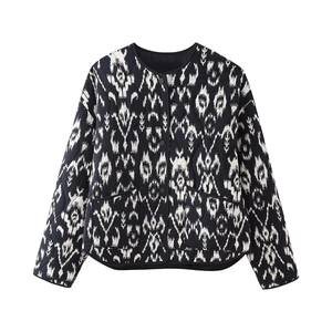 Women's black and white quilted puffer jacket with ethnic patterns and metal buttons