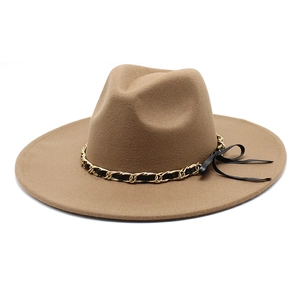 Detailed close-up of wide brim wool fedora hat featuring gold chain and ribbon band