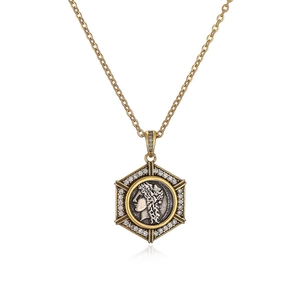 Vintage Roman coin pendant necklace featuring a gold hexagonal frame with silver relief