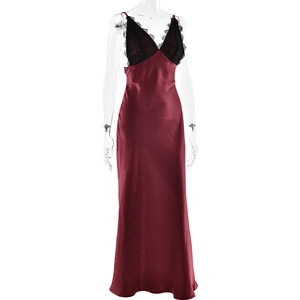 Close-up of elegant burgundy silk dress featuring delicate black lace V-neck and slim fit style
