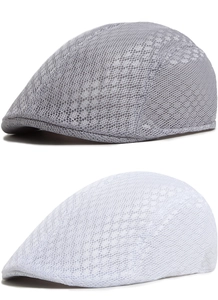 Close-up of breathable honeycomb mesh fabric on grey and white ivy driving caps