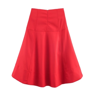Detail view of high-waist red A-line midi skirt with invisible back zipper and seamless stitching