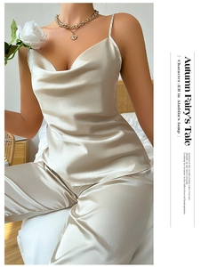 Detail of champagne satin loungewear set featuring cowl neck top and silky fabric texture