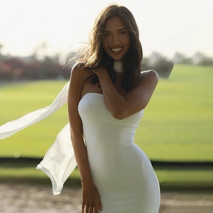 Detail of white mesh streamer scarf on an elegant strapless tube bodycon long dress