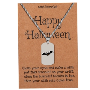 Detail of silver stainless steel bat pendant necklace with Happy Halloween display card