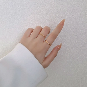 Minimalist gold titanium steel thin rings set with diamond accents for women