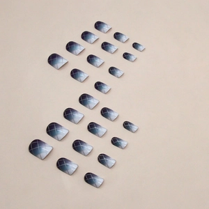 Glossy square press-on nails with blue gradient and silver grid lines on 24-piece set