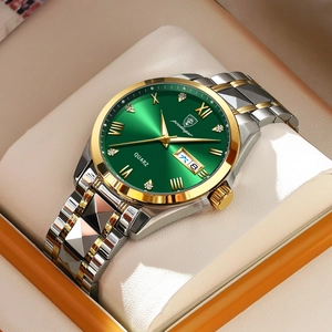 Detail of green sunray dial quartz watch with two-tone steel band in a luxury box