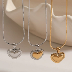 Polished stainless steel heart pendant necklaces in gold and silver on snake chains