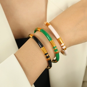 Retro stainless steel bangle with gold sections and enamel drip oil in three colors