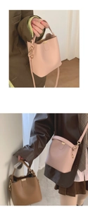 Detail of pink PU leather bucket bag with gold hardware and adjustable strap