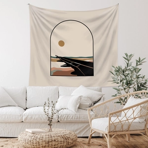 Detail of bohemian tapestry with sunset mountain design on a minimalist white wall