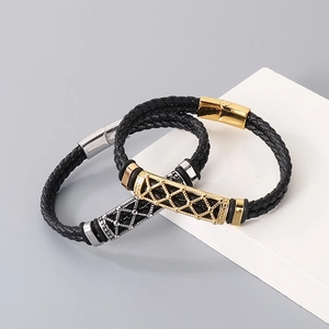 Detail of woven leather bracelets with gold and silver hollowed mesh metal clasps