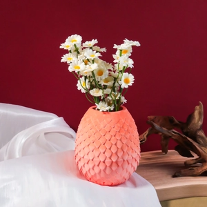 Detail of coral orange scale-textured silicone mold for DIY flower vase and home decor