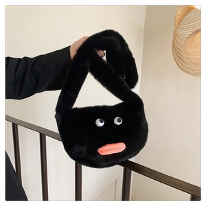 Detail of cute plush crossbody bag featuring funny big eyes and pink sausage lips design