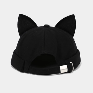 Close-up of black cotton docker hat featuring 3D cat ears and adjustable metal buckle strap