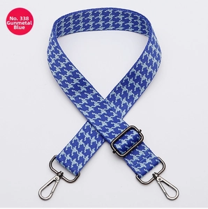 Detail of adjustable blue and white houndstooth strap with gunmetal swivel hooks