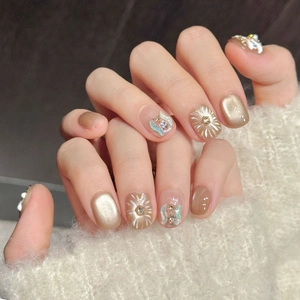 Golden Lion themed press-on nails with cat eye gradient, glitter, and 3D floral accents