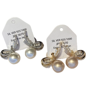Silver 925 bow pearl earrings with cubic zirconia, featuring gold and silver ribbon styles