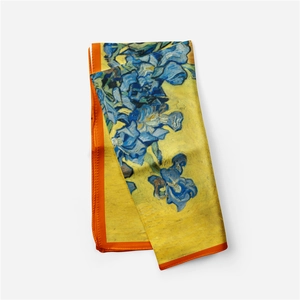 Detail of silk scarf with Van Gogh Iris painting pattern and elegant orange edges