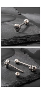 Macro view of stainless steel skull tongue ring showing detailed size 0.67cm x 0.6cm