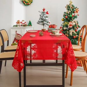 Red Christmas lace tablecloth featuring white snowflake and reindeer hollow patterns