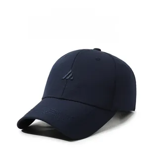 Detail of navy baseball cap featuring 3D embroidery and twill fabric texture
