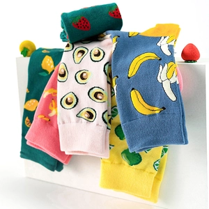 Detail of colorful knitted cotton socks with fruit patterns stacked on display stand
