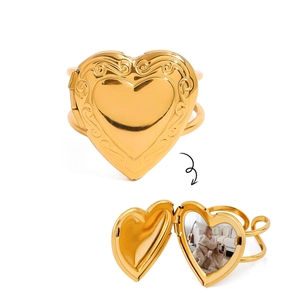 Golden heart-shaped locket ring with vintage scroll engraving and photo compartment