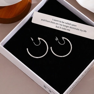 Vintage silver C-shape clip-on earrings in premium jewelry box with decorative card