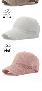 Close-up of pink and white mesh baseball caps with sequins and breathable knit texture