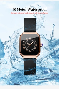 Detail showing 30m waterproof performance of rose gold square quartz watch in splashing water