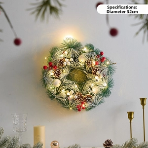 Detail of a 32cm Christmas wreath with warm LED lights, pine cones, and berries