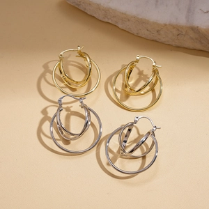 Minimalist geometric hollow round hoop earrings in polished gold and silver metal finishes