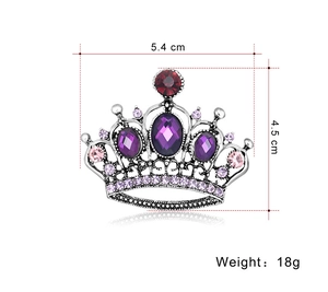 Detailed size guide of a vintage crown brooch featuring purple gems and pink rhinestones