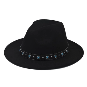 Detailed view of bohemian turquoise bead and silver stud ribbon on a black wool felt hat