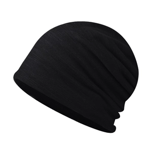 Detailed view of black cotton-blend knit beanie showing soft texture and slouchy shape