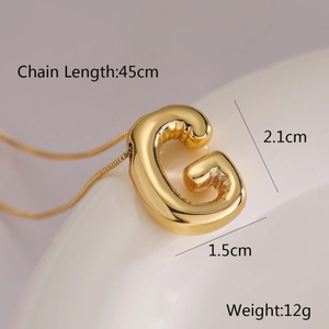 Detail of gold balloon letter G pendant necklace with 45cm chain length and size specs