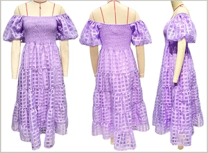 Detail view of purple checkered off-shoulder dress with puff sleeves and layered skirt