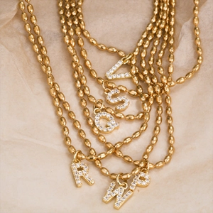 Gold stainless steel bead chain necklace with crystal encrusted initial letter pendants