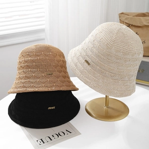 Chic hollow-out knit bucket hats in beige and black with metallic logo for sun protection
