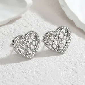 Minimalist hollow heart stud earrings with silver mesh texture and rope pattern edges