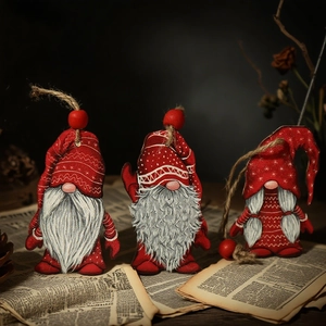 Three-piece red Christmas gnome ornament set with knitted textures on vintage newspaper