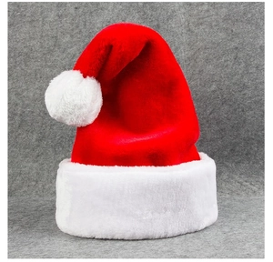 Close-up of thick plush Santa hat with soft white faux fur trim and pom-pom detail