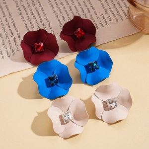 Floral stud earrings with matte finish and center crystals in burgundy, blue, and cream colors