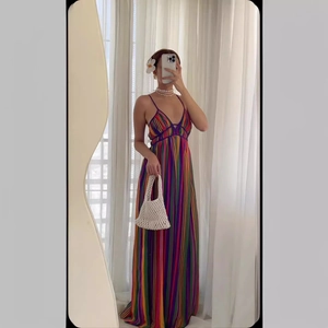 Mirror selfie showing rainbow striped V-neck maxi dress with a bohemian flowy skirt