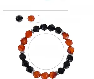 Detail showing 10mm faceted obsidian and red agate beads on elastic cord bracelet