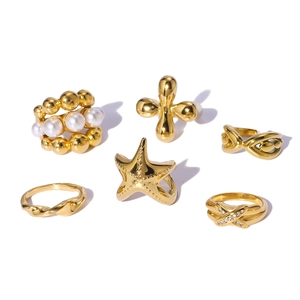 6-piece gold ring set featuring pearls, rhinestones, and geometric cross designs