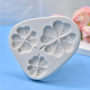Three-cavity four-leaf clover silicone mold with detailed vein textures for DIY crafting