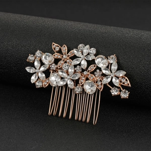Rose gold flower bridal hair comb with sparkling crystals on a black display stand